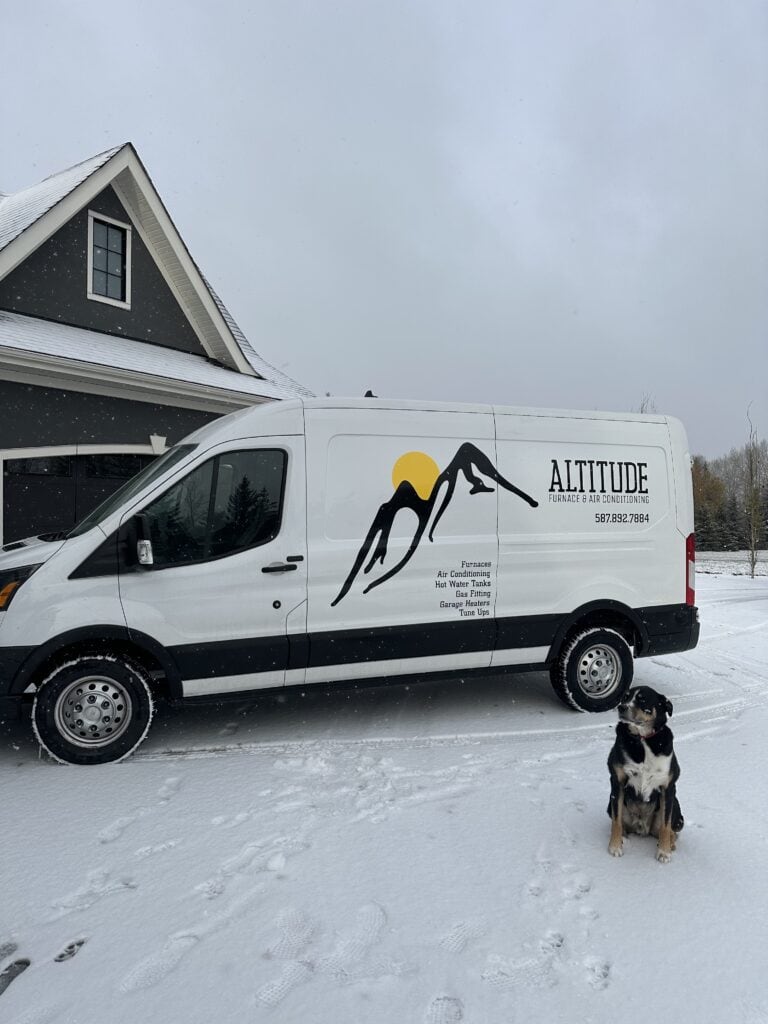Reliable HVAC service vehicle parked outside a modern home in a snowy landscape, featuring mountain and sun logo for Altitude Furnace & Air Conditioning, specializing in heating, cooling, and HVAC repairs.